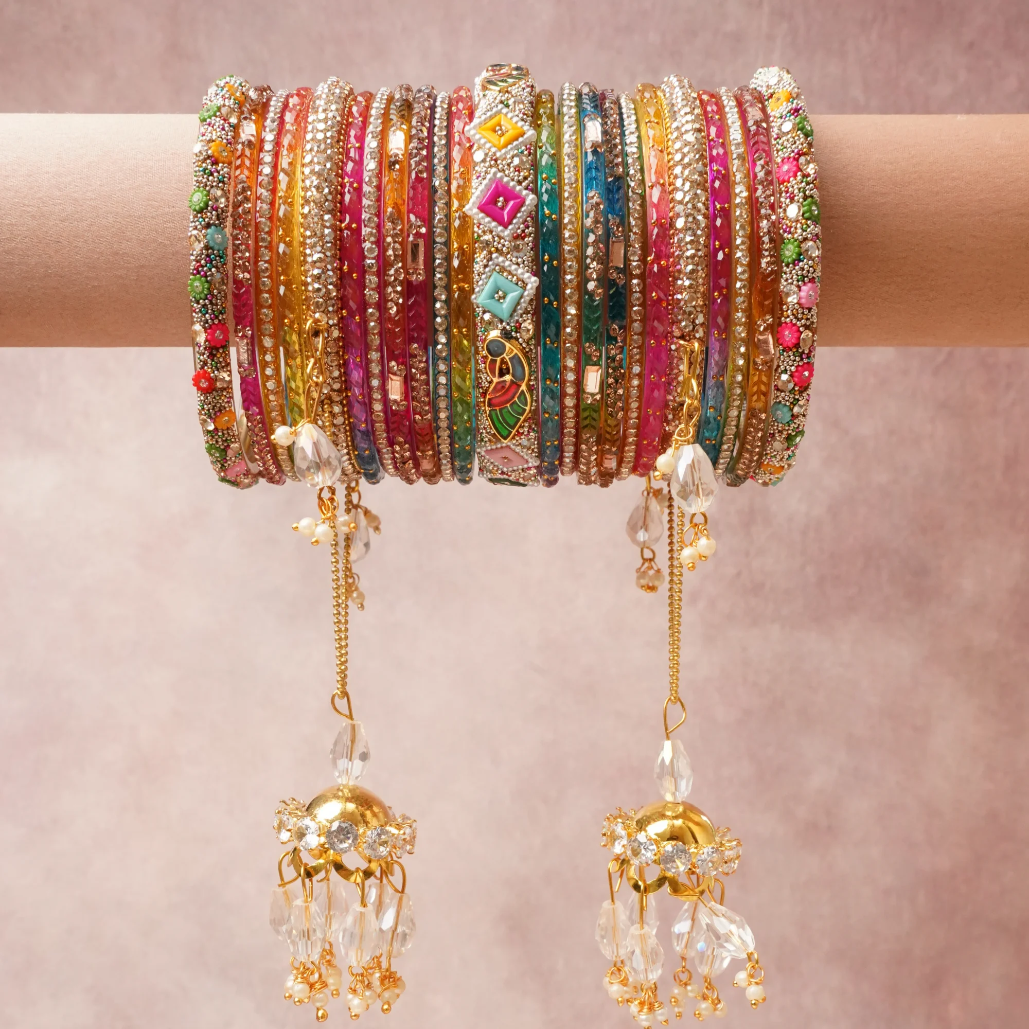 A commanding Multi colour anchors this beautiful set, enriched with accents of Clear Crystal, Pearl White, Clear, Pearlescent White, Metallic Gold, Opaque Enamel (White, Green, Pink, Blue, Red) that add depth and dimension.

Featuring a striking composition of Glass, Metal Alloy, Rhinestones, Enamel, Faux Pearls, Crystal, this set carries intricate craftsmanship and strong presence. Grand in form, it is created for moments that deserve to be marked.